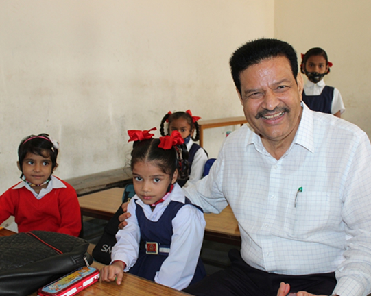 School Adoption - Chancellor with school children